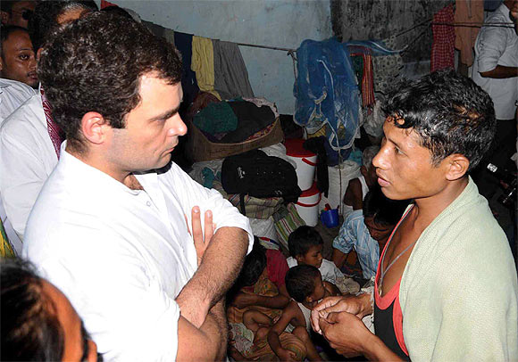 Rahul listens to woes of a youth in a relief camp in Gosaigaon in Assam's Kokrajhar district