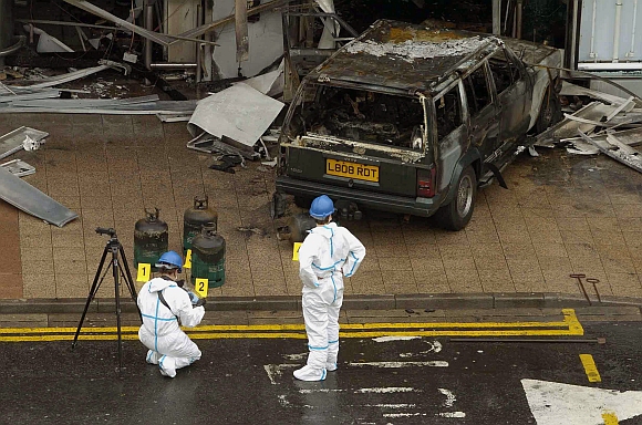 Forensic officers examine the scene of attack on the terminal building at Glasgow Airport Glasgow Scotland