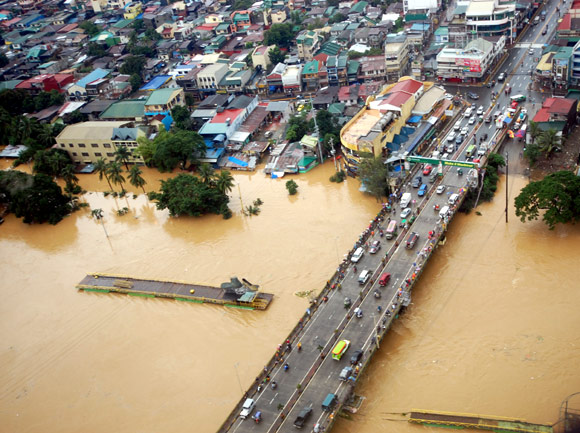 The overflowing Marikina river in Marikina, Metro Manila, is seen in this aerial photograph dated August 8, 2012