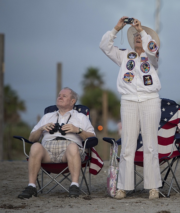 Jorgen and Ruth Sabinsky watch the fly-over of the space shuttle Endeavour atop NASA's Shuttle Carrier Aircraft