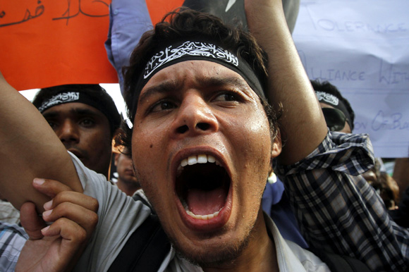 Students shout anti-American slogans during a protest rally in Karachi