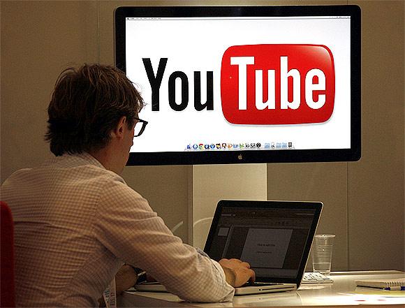 A visitor is seen at the You Tube stand during the annual MIPCOM television programme market in Cannes