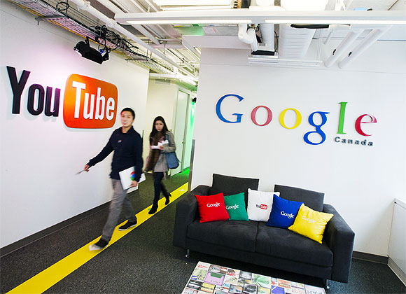 -People walk by a YouTube sign at the new Google office in Toronto