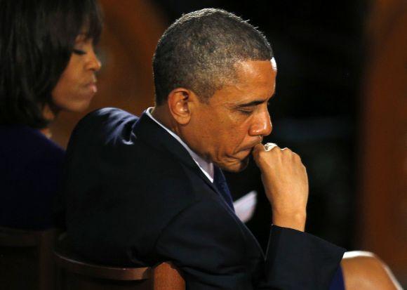 U.S. President Barack Obama and his wife Michelle attend an interfaith memorial service for the victims of the bombing at the Boston Marathon in Boston, Massachusetts