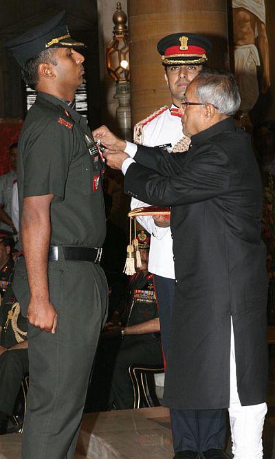 President Pranab Mukherjee presenting the Kirti Chakra to Major Anup Joseph Manjali