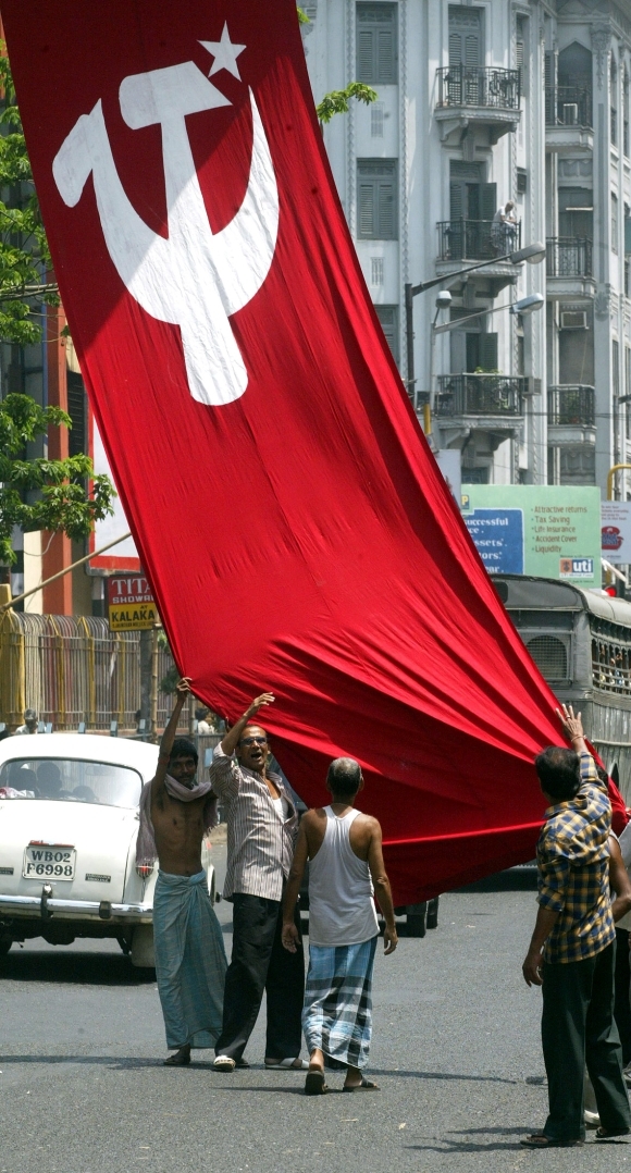 Communist activists with the party flag 