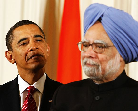 US President Barack Obama listens while Prime Minister Manmohan Singh address a gathering at White House in November, 2009.