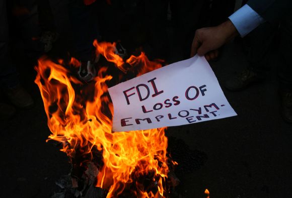 Activists protest in Mumbai against central government's move to bring in FDI in multi-brand retail.