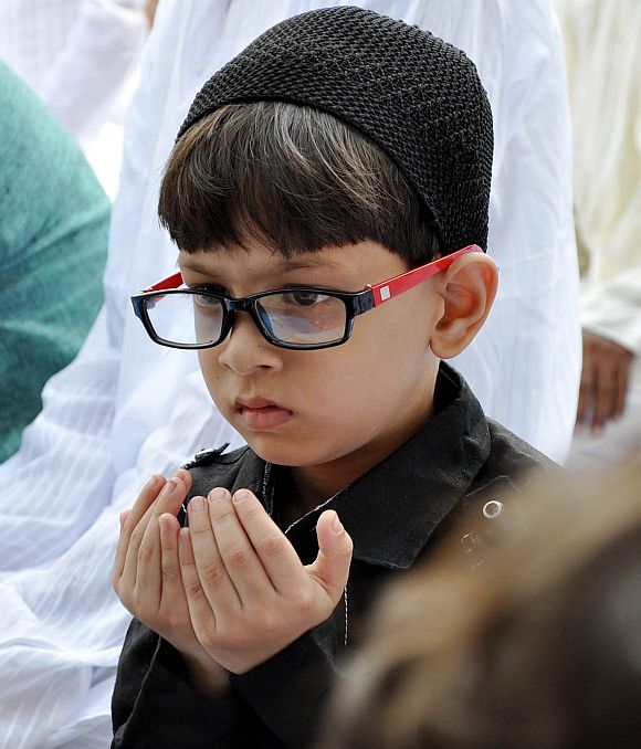 A young boy offers Eid prayers at a mosque in Guwahati, Assam
