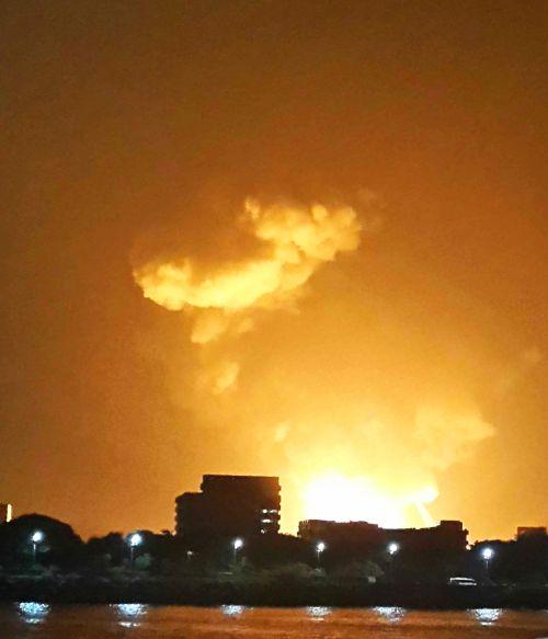 A view of the flames from the burning Indian Navy submarine INS Sindhurakshak in Mumbai late Tuesday night