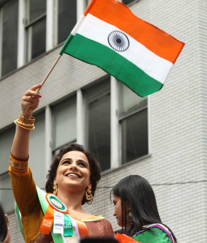 Bollywood actor Vidya Balan waves the tricolour at the India Day Parade in New York