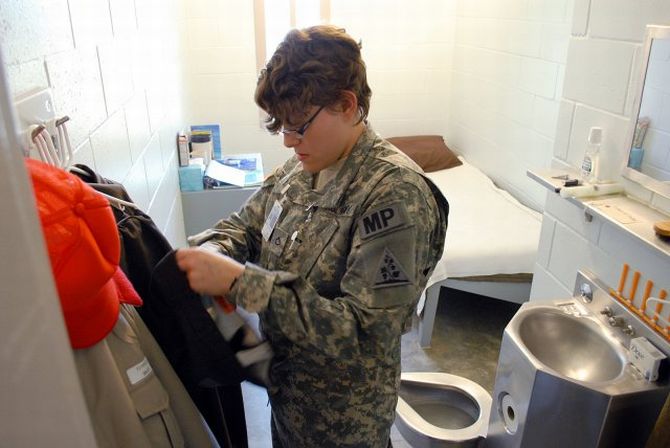 This could be the type of cell that Manning could be incarcerated in. Here, a soldier is seen demonstrating a cell search at the US Disciplinary Barracks
