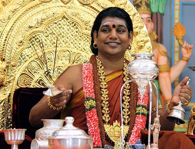 Image result for Marxist party against Nithyananda