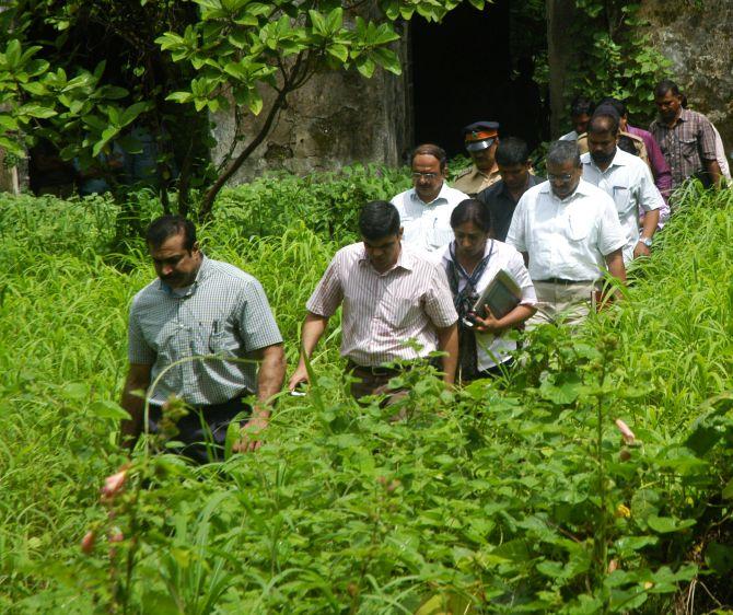 Joint Commissioner of Police, Crime, Himanshu Roy heads to the crime scene with other officials