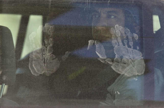 Handprints are pictured on a UN vehicle carrying a team of chemical weapons experts visiting one of the sites of an alleged chemical weapons attack in the Ain Tarma neighbourhood of Damascus