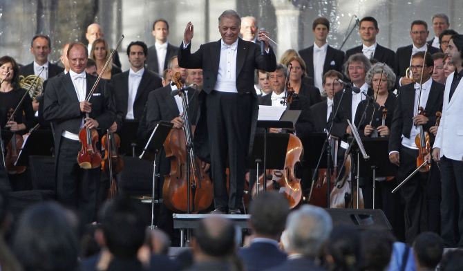 Renowned conductor Zubin Mehta gestures before performing at the Ehasas-e-Kashmir concert at Shalimar Garden on the outskirts of Srinagar.