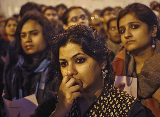 Demonstrators attend a candlelight vigil to mark the first anniversary of Delhi gang rape