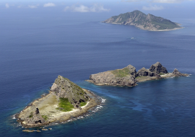 A group of disputed islands, Uotsuri island (top), Minamikojima (bottom) and Kitakojima, known as Senkaku in Japan and Diaoyu in China is seen in the East China Sea, in this photo taken by Kyodo