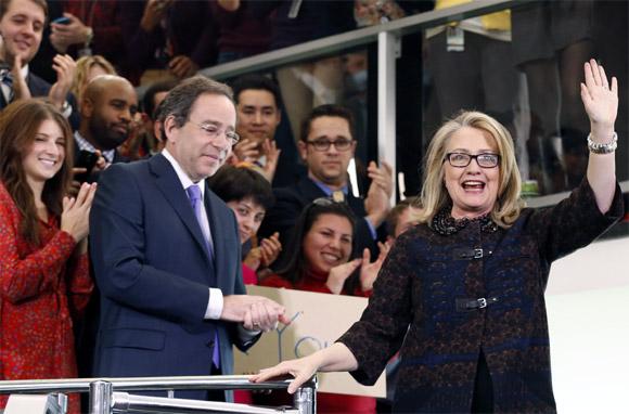 US Secretary of State Hillary Clinton waves goodbye on her last day in office at the state department in Washington