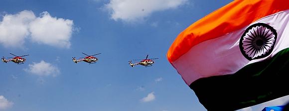 Indian Air Force's Sarang helicopters perform in Aero India 2013