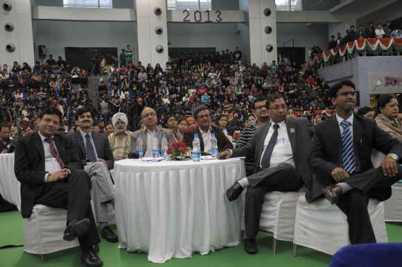 Students and faculty members listen to Gujarat Chief Minister Narendra Modi's speech at Delhi's Sri Ram College of Commerce