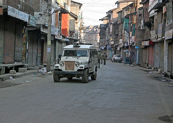 Security personnel patrolling a deserted street