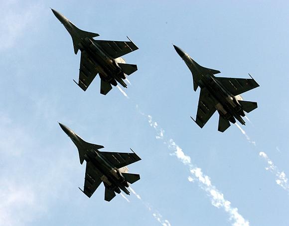 Three SU 30 MKI carrying out THE fly past at Indian Air Force Fire Power demonstration Exercise 'Iron Fist 2013' at Pokhran Firing Range, Jaisalmer, Rajasthan