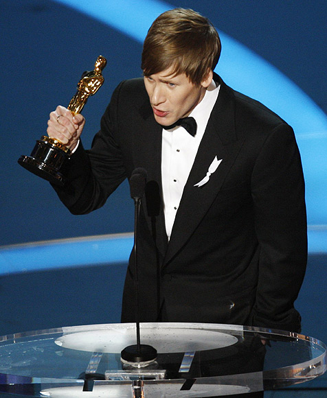 Dustin Lance Black holds the Oscar for best original screenplay for 'Milk' during the 81st Academy Awards in Hollywood, California on February 22, 2009