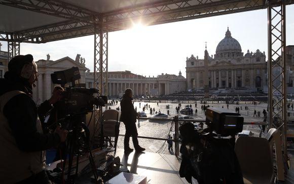 A technician works on a structure set up for TV media in front of St. Peter's Square in Rome. Pope Benedict will keep the honorific title of 'His Holiness' after he abdicates this week and will be known as 'pope emeritus', the Vatican said.