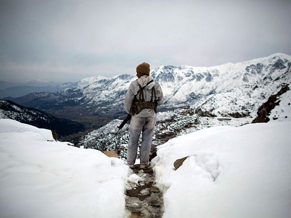 An Indian soldier maintains vigil on India's border with China