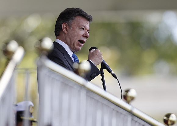 Colombian President Juan Manuel Santos gives a speech during promotion ceremony at a police school in Bogota