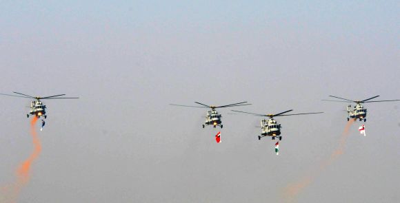 The IAF Helicopters carrying the tricolour and three services flag, during the 64th Republic Day parade at Rajpath