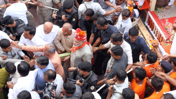 Security personnel make way for Modi at the yatra 