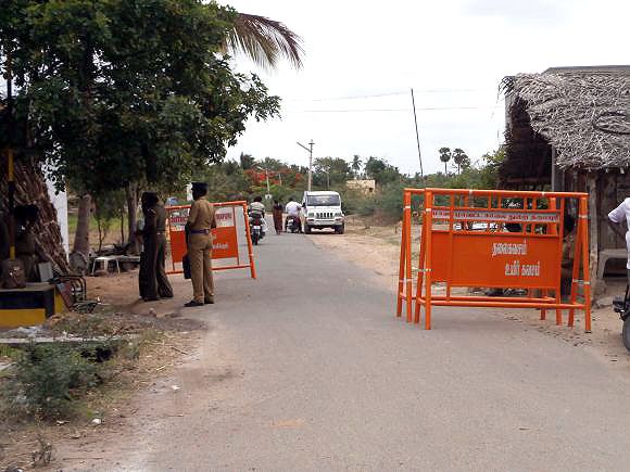 A police barricade on the road leading to Ilavarsan's village