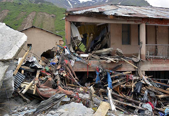 A body lies amid damaged surroundings by flood waters near Kedarnath Temple at Rudraprayag in Uttarakhand