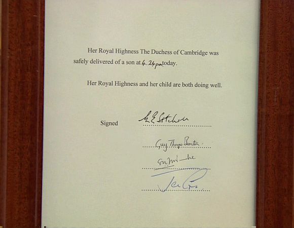 A notice formally announcing the birth of a son to Britain's Prince William and Catherine, Duchess of Cambridge, is placed in the forecourt of Buckingham Palace, in central London 