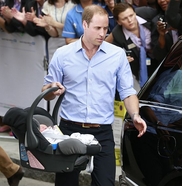 Britain's Prince William and his wife Catherine, Duchess of Cambridge appear with their baby son outside the Lindo Wing of St Mary's Hospital, in central London