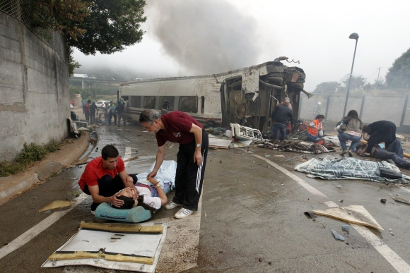 Victims receive help after a train crashed near Santiago de Compostela