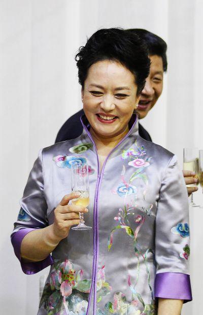 China's first lady Peng Liyuan with her husband President Xi Jinping during an official visit to South Africa