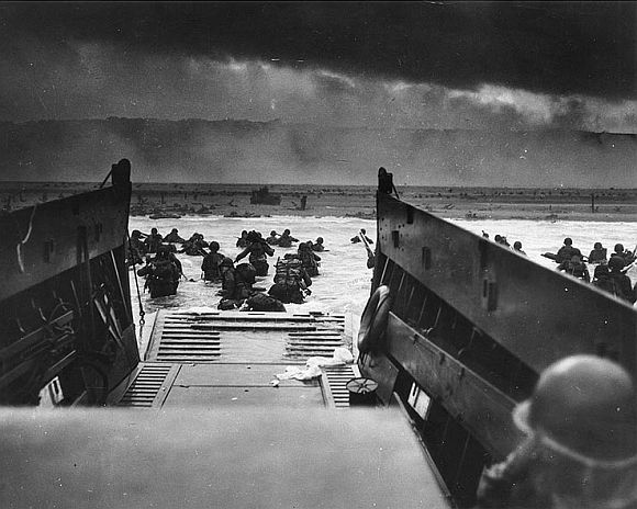 Troops wade ashore on Omaha beach, June 6, 1944