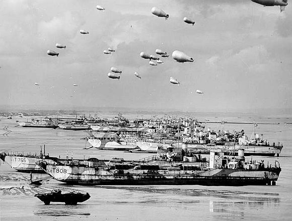 British LCT's line the Normandy shore, each with a barrage balloon designed to discourage enemy air attack in this file photo taken sometime before D-Day invasion