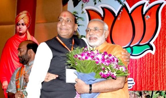 BJP chief Rajnath Singh hugs Gujarat Chief Minister Narendra Modi at the Goa conclave on Sunday