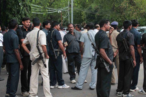 Bodyguards of different politicians idle around as their bosses attend proceedings in the Andhra Pradesh assembly in Hyderabad