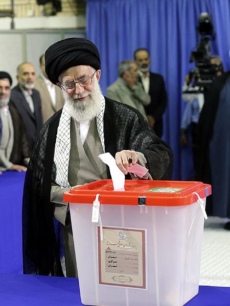 Iran's Supreme Leader Ayatollah Ali Khamenei casts his ballot at his office during the Iranian presidential election in central Tehran