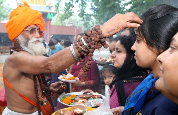 A sadhu blesses devotees at Khir Bhawani temple in Kashmir