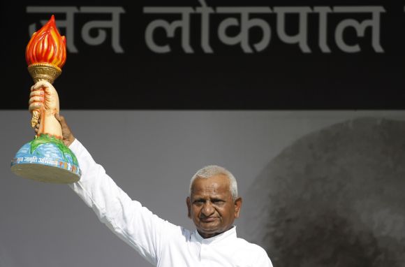 Anna Hazare gestures while addressing supporters during his fast to bring in Jan Lokpal Bill, at Ramlila Maidan in New Delhi