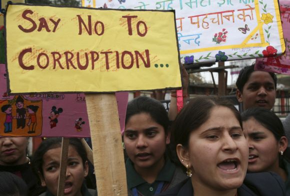 School students participate in an anti-corruption demonstration in Jammu