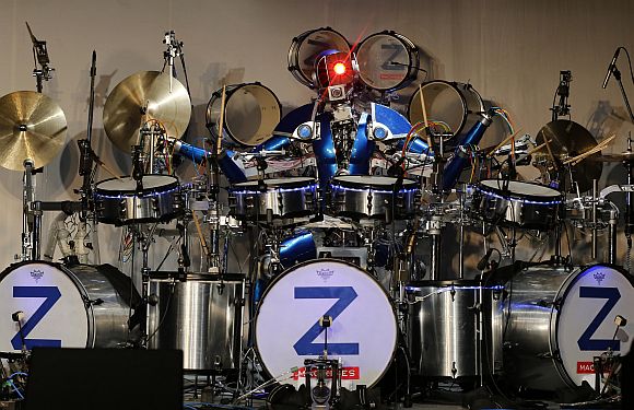 Robot rock band Z-Machines' drummer Ashura performs during the band's debut live concert