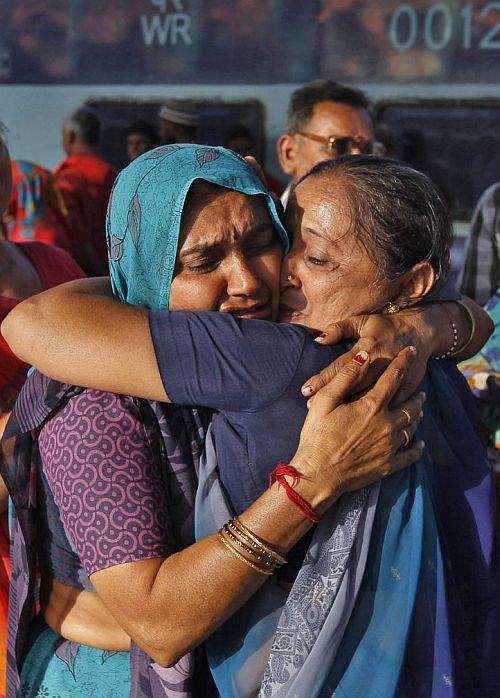 A pilgrim who was stranded in Uttarakhand reacts after meeting her relative