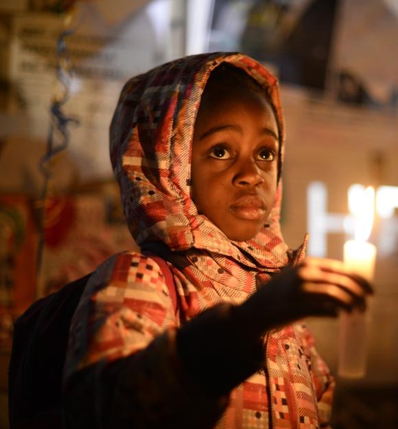 Wellwishers hold candles as they gather in support of ailing former South African President Nelson Mandela outside the Medi-Clinic Heart Hospital where he is being treated in Pretoria 